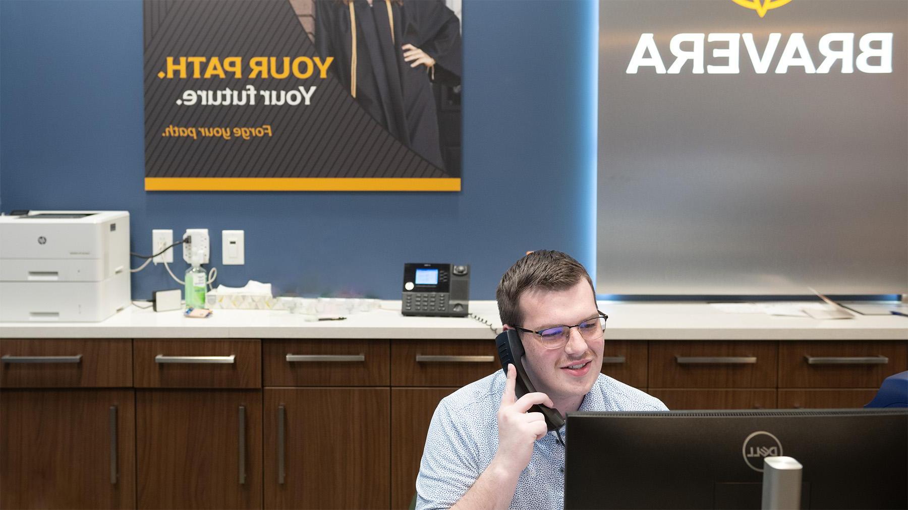 Student working at the bank on campus